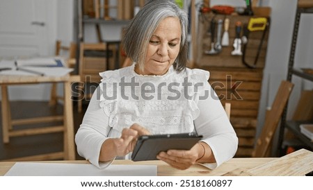 Similar – Image, Stock Photo Senior craftswoman with tablet computer in art studio