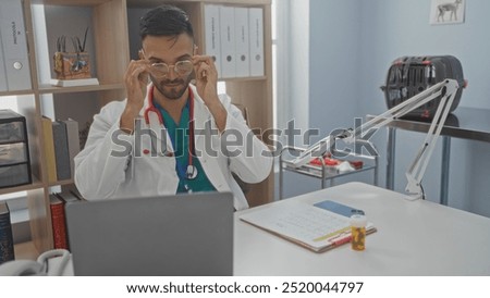 Similar – Image, Stock Photo young veterinarian man reading documents about illness of a cute small dog.on white background. Indoors