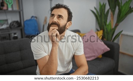 Similar – Image, Stock Photo adult man reflecting on his future