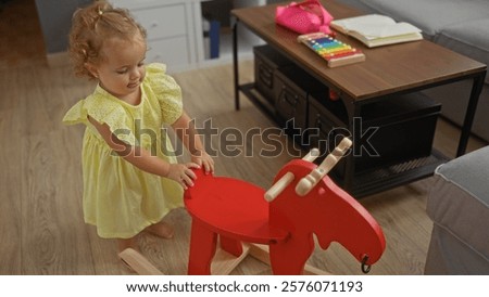 Similar – Image, Stock Photo Cute blond toddler on the swing