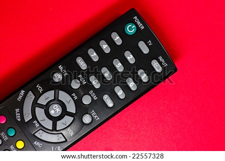 remote control on red background