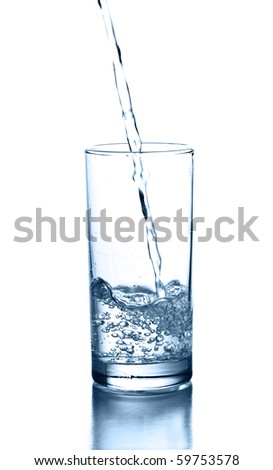 Fresh water pouring in a glass on white background.