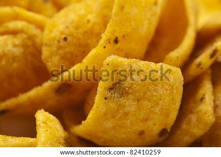tasty fried potatoes chips stack extreme closeup