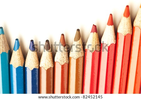 closeup of crayons stack on white background