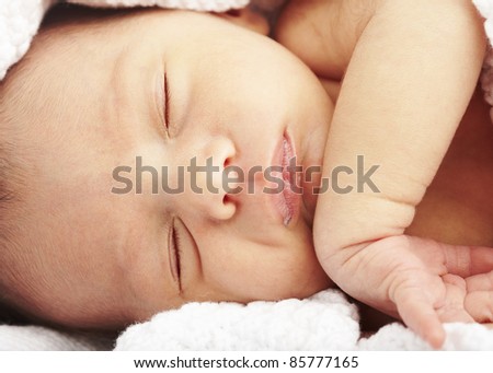 portrait of newborn baby sleeping on a blanket