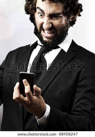 stock photo : portrait of young business man angry with the new technologies in the house