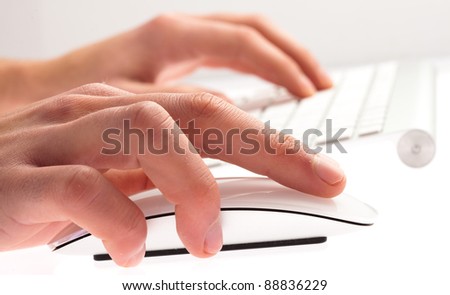 man typing with keyboard on a white background