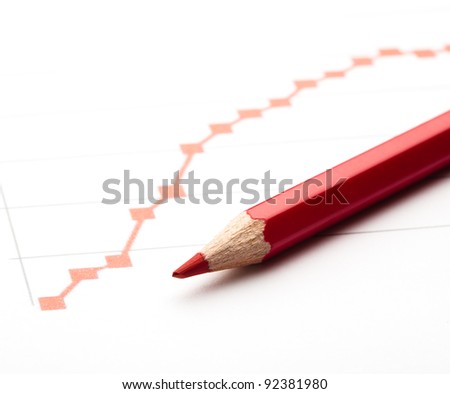 red pen painting a red line graph