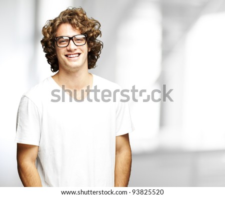 portrait of a handsome young man smiling indoor