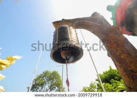 The Buddhist bell hanging against the clear blue sky at midday in Thailand Buddhist Shrine Nam Hai Kwan Se Im Pu Sa Vihara Sukabumi, Indonesia. Stok fotoğraf © 