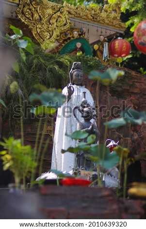 Chinese Bodhisattva or Goddess of Compassion, Mercy and Kindness statue, also known as, Guan Yim or Dewi Kwan Im at Thailand Buddhism Shrine Nam Hai Kwan Se Im Pu Sa Vihara Sukabumi, Indonesia. Stok fotoğraf © 