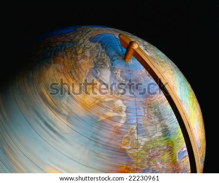 Close up of a spinning globe on black