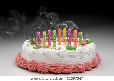 Birthday cake with smoke coming from blown out candles