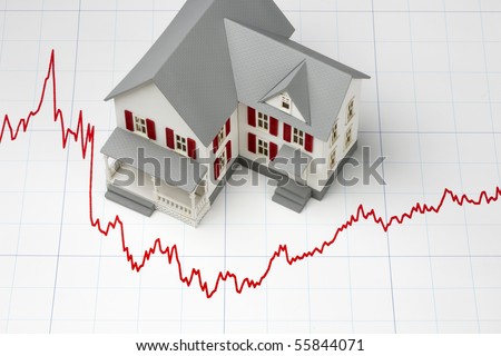 Model of house shot on graph depicting mortgage rates