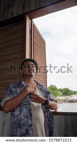 Similar – Image, Stock Photo Contemplative Asian man leaning on hand against brick building