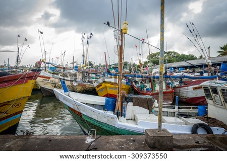 SRI LANKA. BERUWELA - August 15, 2015. Port. Fish market. Fishing boats at the pier.