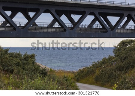 Part of the bridge over Oresund, Oresundsbron, at the start point on the Swedish side with a road below the bridge.