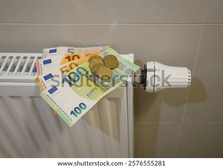 Similar – Image, Stock Photo euro banknotes on radiator as concept for rising heating costs and gas price crisis