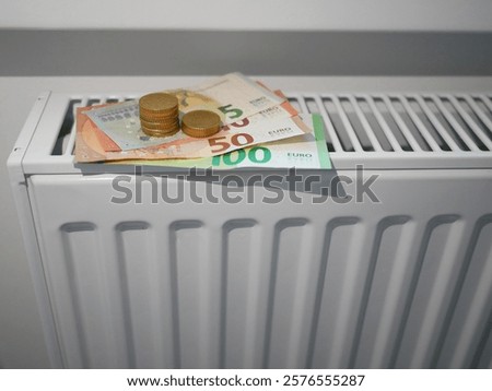 Similar – Image, Stock Photo euro banknotes on radiator as concept for rising heating costs and gas price crisis