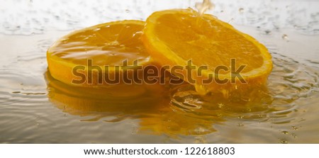orange juice splashing isolated on white