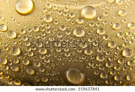 drops of water on a gold background