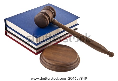 wooden mallet and a book on a white background