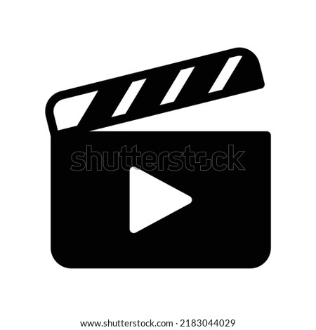 Movie clapboard icon in black solid style