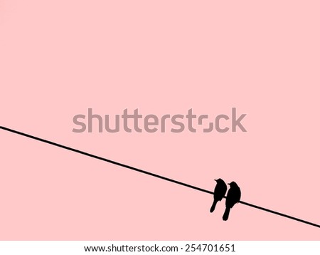 Two silhouette birds perching on wire on old rose pink background