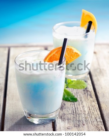 Swimming Pool Cocktail on an aged wooden deck at the south pacific near the ocean, for Tropical Food and Beverages Concepts. Visit my Portfolio for more Drinks