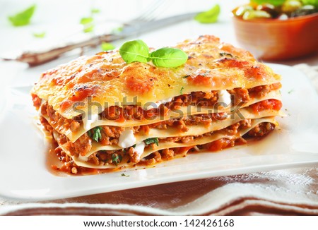 Similar – Image, Stock Photo Fresh cooked food in baking dish with various ingredients. Kitchen equipment. Dark concrete background.Flat lay. Top view