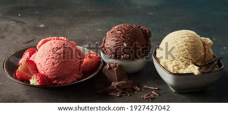 Wide angle of collection of delicious gelati with fresh strawberries and grated chocolate with aromatic vanilla pod