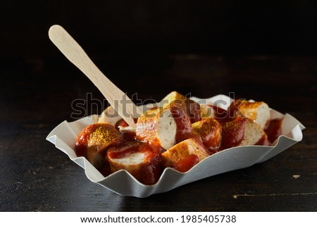 Similar – Foto Bild Currywurst in einer Pappschale mit rotem Piekser