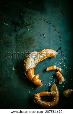 Similar – Image, Stock Photo Knotted remainder of an orange fluttering band on a rusty iron bar of a fence in front of a brown background