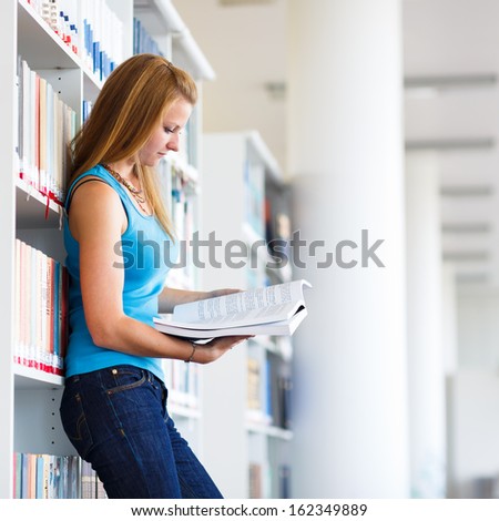 pretty young college student in a library (shallow DOF; color toned image)