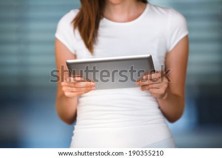 Pretty, young businesswoman/colle ge student using her tablet computer (shallow DOF; color toned image) Photo stock © 