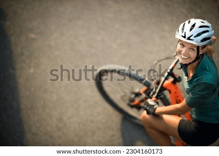 Similar – Image, Stock Photo Young woman mountain biking