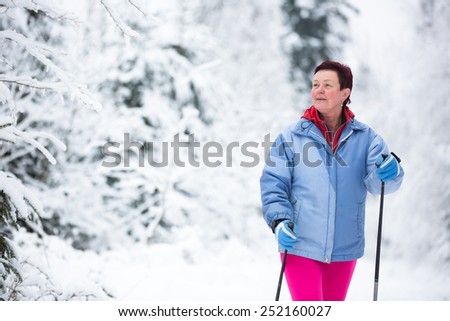 Cross-country skiing: two women cross-country skiing on a winter day (motion blurred image)