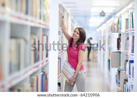 pretty young college student in an university library (shallow DOF; color toned image)