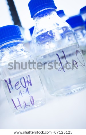 Glassware in a chemistry lab (shallow DOF; focus on the beakers in the foreground)