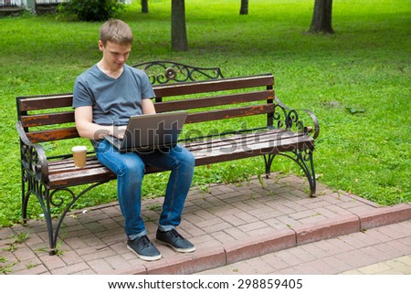 Guy with laptop in the park