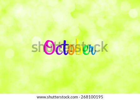 October writing with defocused light blur bokeh background