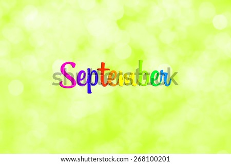 September  writing with defocused light blur bokeh background