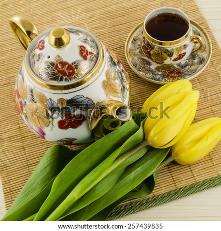 Porcelain coffee set with yellow tulip flowers