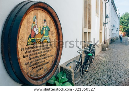 Aachen , germany 21 august 2015: Beer barrel with a bike selective color