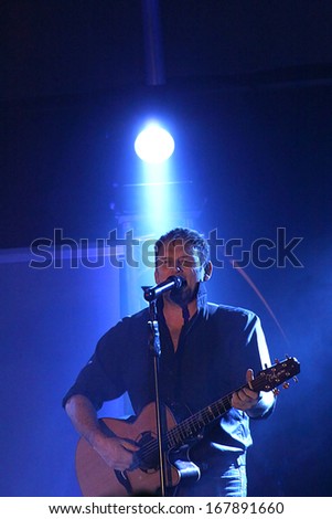 RUSTENBURG, SOUTH AFRICA - JULY 26: Singer, Songwriter and Actor, Steve Hofmeyr Performing a Song on Stage on July 26, 2013, Rustenburg, South Africa.