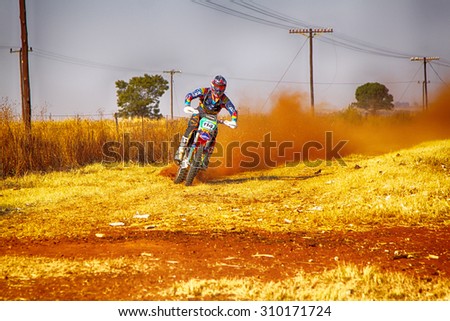 KOSTER, SOUTH AFRICA - July 11:  Africa-Offroad Racing Rally,  on July 11, 2015 at Koster, North West Province, South Africa.  HD - Motorbike kicking up trail of dust on sand track during rally race.