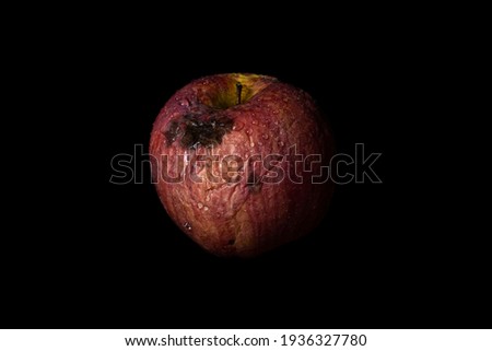Rotten Apple isolated on black background. Concept of decay, aging, sadness and fading away.  Stock foto © 