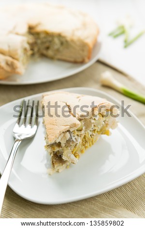Savory pie slice with ricotta cheese and artichokes
