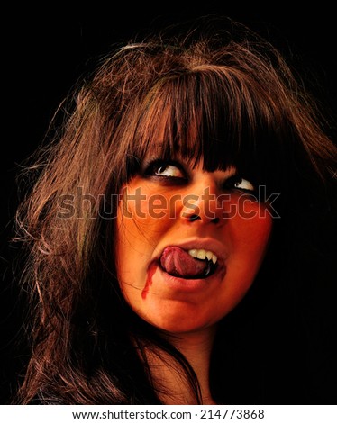vampire. woman with scary makeup on black  background