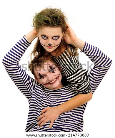 Man and woman with scary makeup on white background